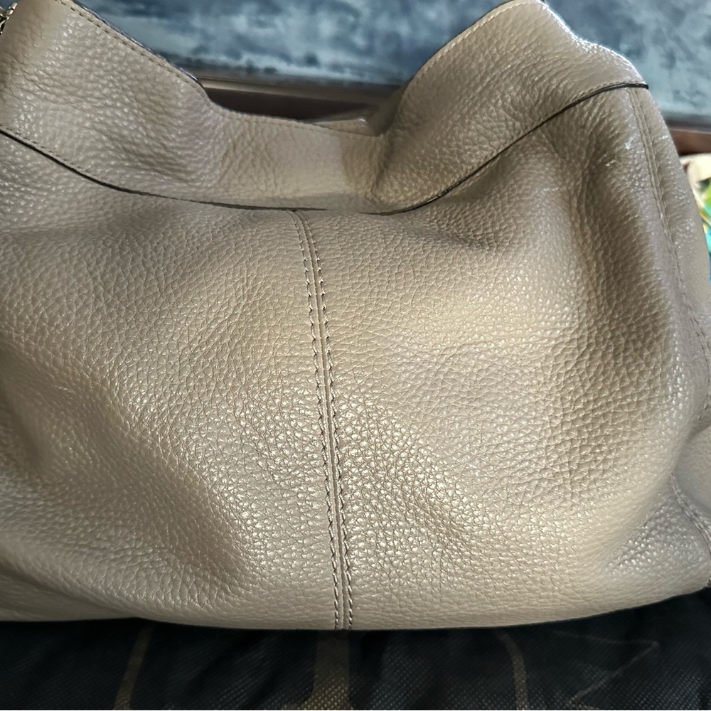 Gray Coach handbag.